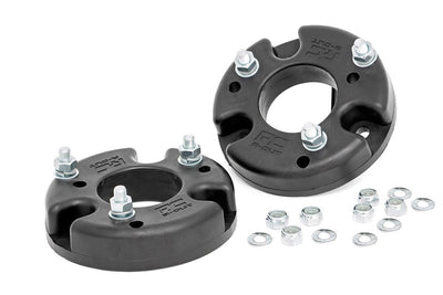 Image of automotive leveling kits, including spacers and coil springs, used to raise the front of trucks and SUVs for a balanced stance, improved clearance, and larger tires.